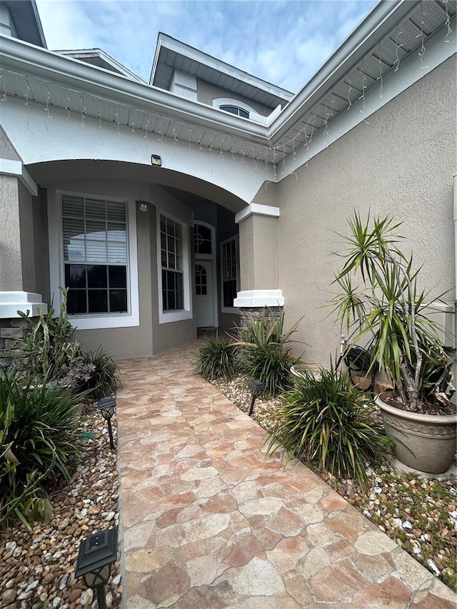 3244 River Branch Cir, Kissimmee, FL 34741 - doorway to property featuring stucco siding