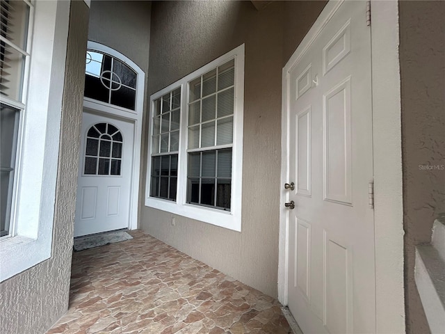 3244 River Branch Cir, Kissimmee, FL 34741 - property entrance with stucco siding and covered porch