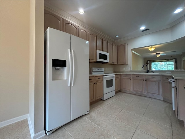 3244 River Branch Cir, Kissimmee, FL 34741 - kitchen featuring white appliances, a sink, light countertops, light tile patterned floors, and recessed lighting