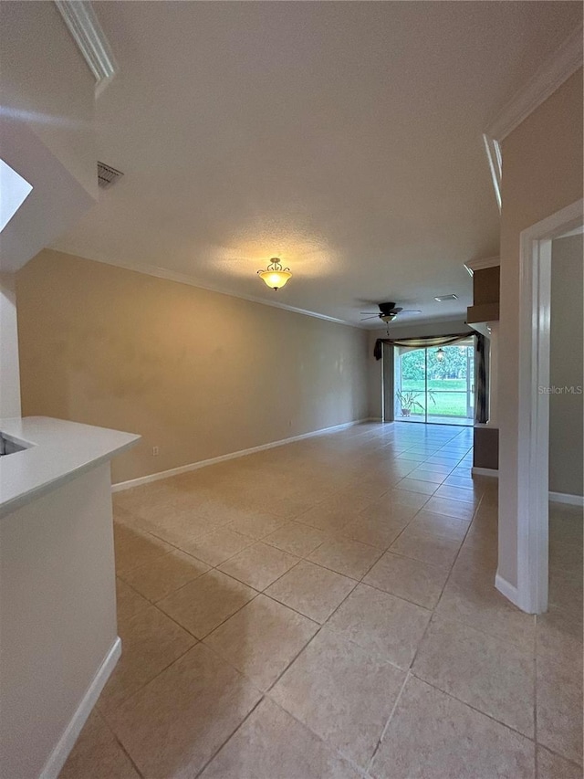 3244 River Branch Cir, Kissimmee, FL 34741 - spare room featuring light tile patterned floors, crown molding, baseboards, and a ceiling fan