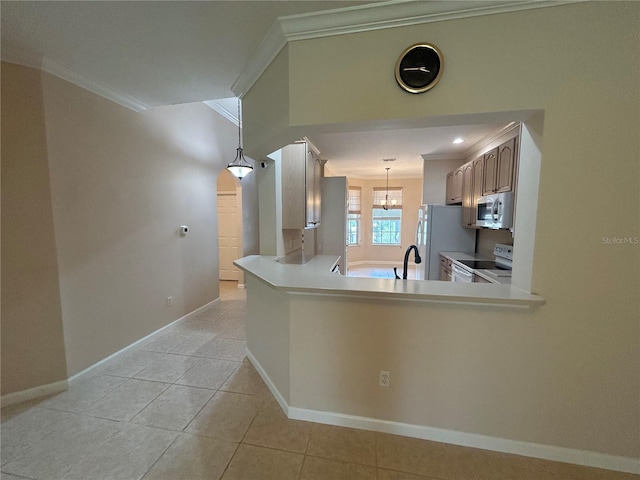 3244 River Branch Cir, Kissimmee, FL 34741 - kitchen with white appliances, crown molding, light countertops, baseboards, and light tile patterned floors