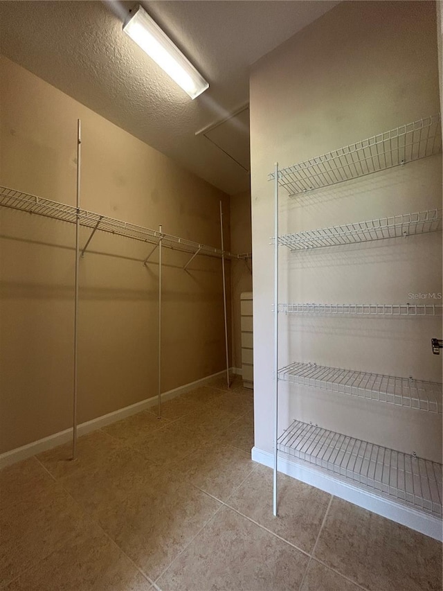 3244 River Branch Cir, Kissimmee, FL 34741 - spacious closet with light tile patterned floors