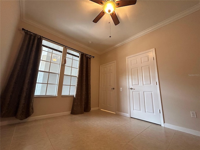 3244 River Branch Cir, Kissimmee, FL 34741 - spare room featuring ornamental molding, ceiling fan, baseboards, and light tile patterned floors