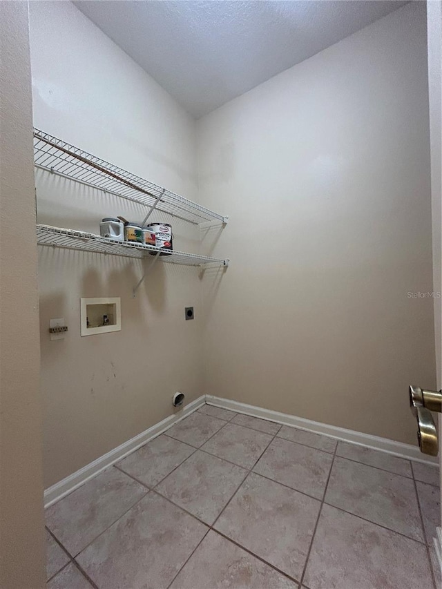 3244 River Branch Cir, Kissimmee, FL 34741 - washroom featuring hookup for an electric dryer, hookup for a washing machine, baseboards, and light tile patterned floors