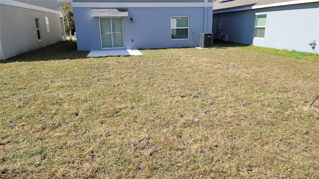 443 Cool Summer Ln, Davenport, FL 33837 - view of grassy yard with central AC unit