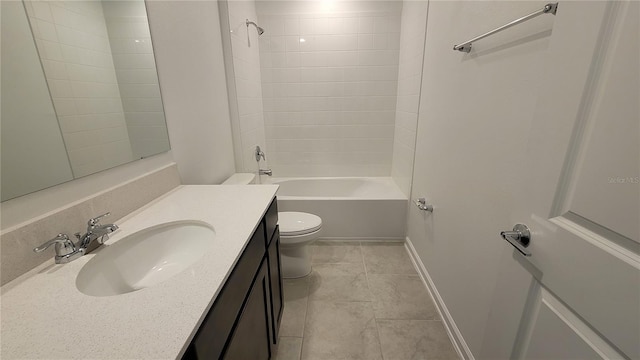 443 Cool Summer Ln, Davenport, FL 33837 - full bath with vanity, toilet, tub / shower combination, tile patterned flooring, and baseboards