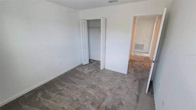 443 Cool Summer Ln, Davenport, FL 33837 - unfurnished bedroom with carpet floors, baseboards, and a closet