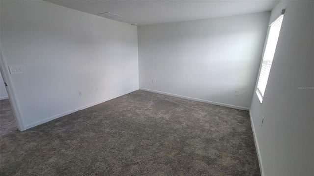 443 Cool Summer Ln, Davenport, FL 33837 - unfurnished room featuring dark carpet and baseboards