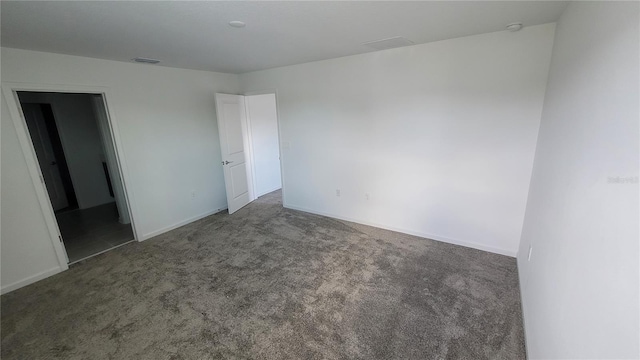 443 Cool Summer Ln, Davenport, FL 33837 - unfurnished bedroom with carpet floors and baseboards