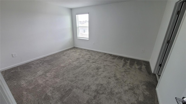 443 Cool Summer Ln, Davenport, FL 33837 - unfurnished room with dark colored carpet and baseboards