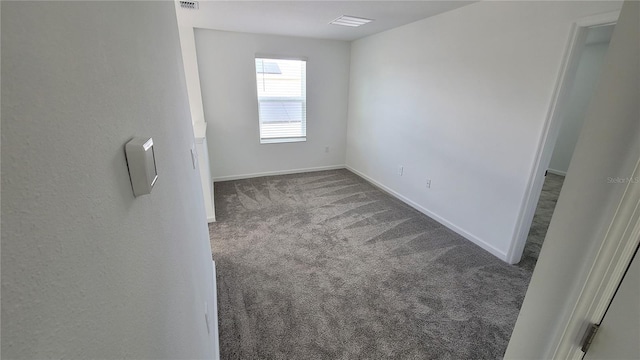 443 Cool Summer Ln, Davenport, FL 33837 - spare room featuring carpet flooring and baseboards
