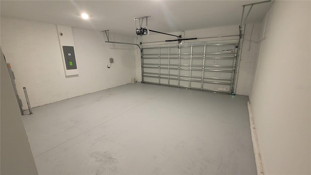 443 Cool Summer Ln, Davenport, FL 33837 - garage featuring electric panel and a garage door opener