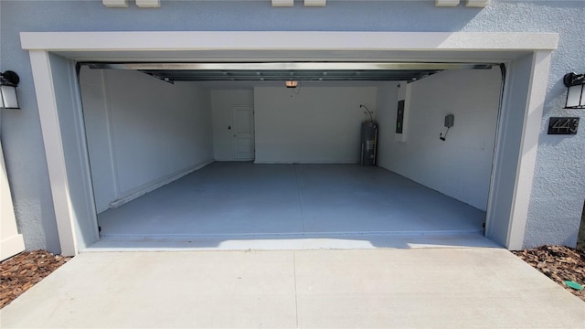 443 Cool Summer Ln, Davenport, FL 33837 - garage featuring water heater and electric panel