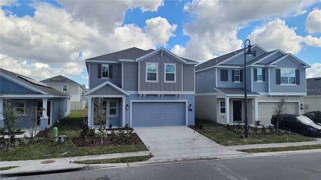 443 Cool Summer Ln, Davenport, FL 33837 - view of front of property with a garage, driveway, board and batten siding, and roof with shingles