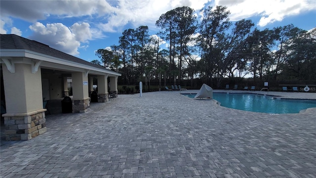 443 Cool Summer Ln, Davenport, FL 33837 - community pool with a patio area