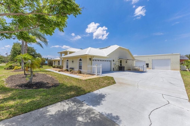 6555 Bay Tree Ct, Saint Cloud, FL 34771 - single story home featuring a garage, central air condition unit, and driveway