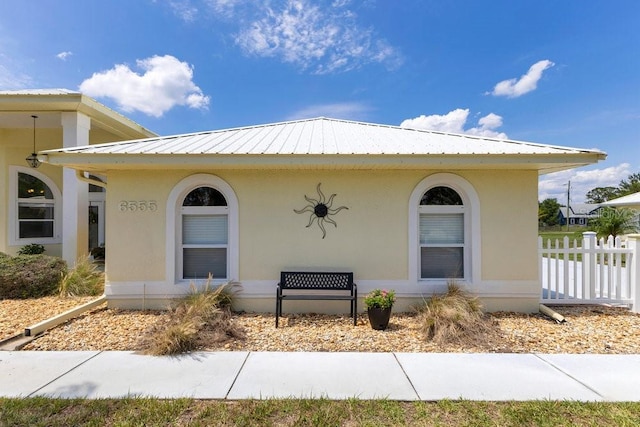 6555 Bay Tree Ct, Saint Cloud, FL 34771 - view of front of home with stucco siding and metal roof