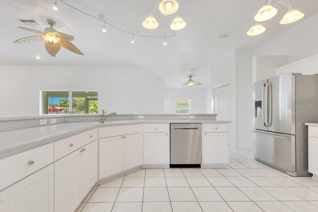 6555 Bay Tree Ct, Saint Cloud, FL 34771 - kitchen with stainless steel appliances, a ceiling fan, a sink, light countertops, and white cabinets