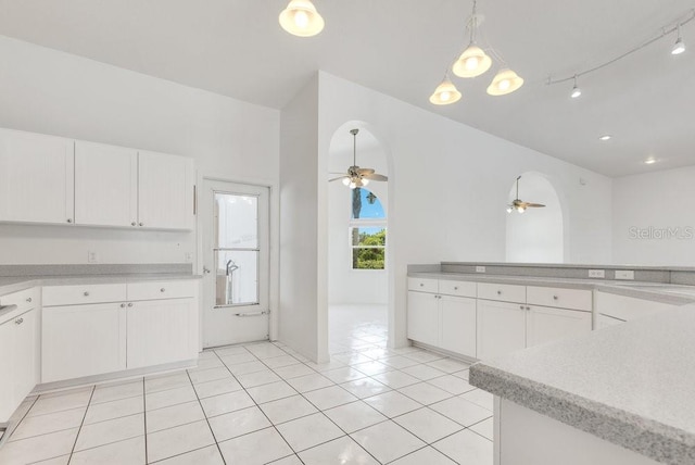 6555 Bay Tree Ct, Saint Cloud, FL 34771 - kitchen with ceiling fan, white cabinetry, and light countertops