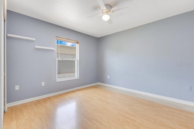 6555 Bay Tree Ct, Saint Cloud, FL 34771 - empty room with a ceiling fan, wood finished floors, and baseboards