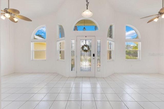 6555 Bay Tree Ct, Saint Cloud, FL 34771 - entrance foyer featuring ceiling fan, tile patterned floors, and a high ceiling