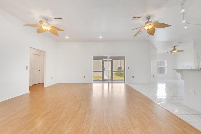 6555 Bay Tree Ct, Saint Cloud, FL 34771 - unfurnished living room featuring plenty of natural light, a ceiling fan, light wood-type flooring, and recessed lighting