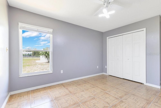 6555 Bay Tree Ct, Saint Cloud, FL 34771 - unfurnished bedroom with baseboards, a closet, and a ceiling fan