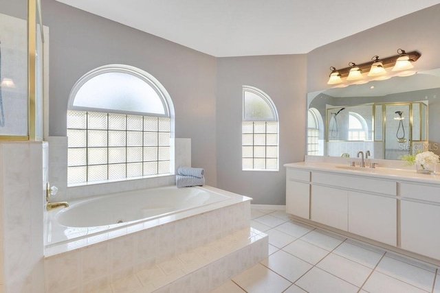 6555 Bay Tree Ct, Saint Cloud, FL 34771 - full bath featuring vanity, a tub with jets, a stall shower, and tile patterned floors