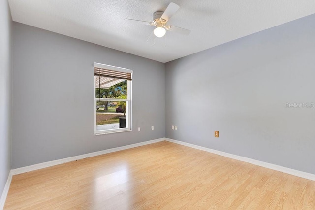 6555 Bay Tree Ct, Saint Cloud, FL 34771 - spare room with light wood-style flooring, baseboards, and a ceiling fan