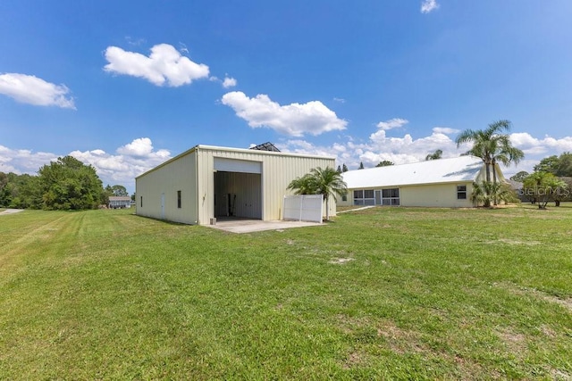 6555 Bay Tree Ct, Saint Cloud, FL 34771 - rear view of house featuring a garage and a lawn