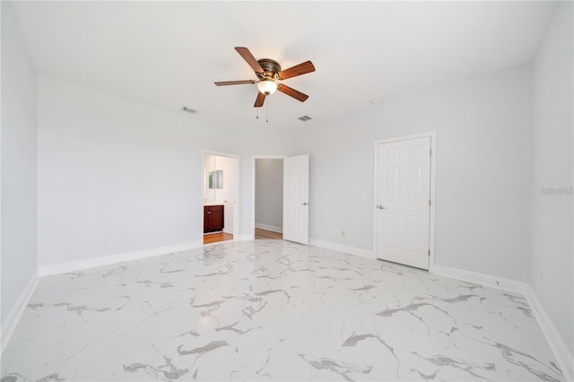 2333 Pinehurst Ct, Davenport, FL 33837 - spare room with light marble finish floors, a ceiling fan, and baseboards