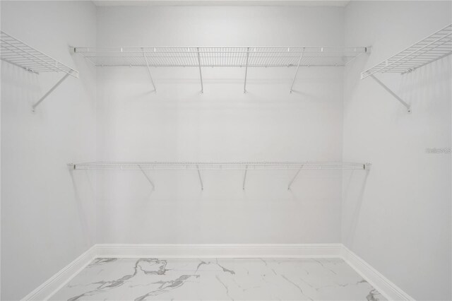 2333 Pinehurst Ct, Davenport, FL 33837 - spacious closet featuring marble finish flooring