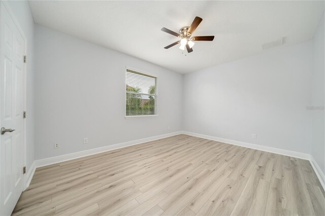 2333 Pinehurst Ct, Davenport, FL 33837 - unfurnished room with light wood-type flooring, a ceiling fan, and baseboards