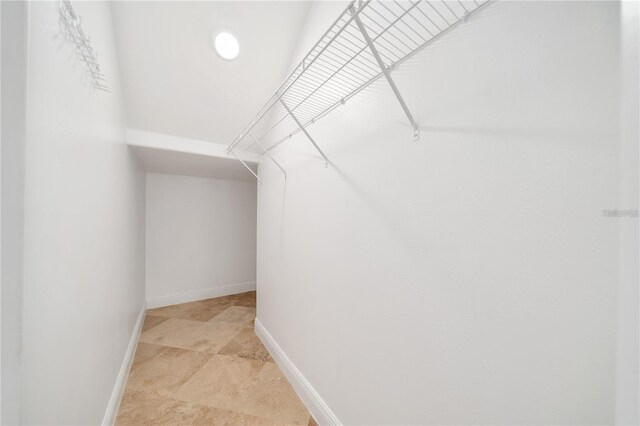 2333 Pinehurst Ct, Davenport, FL 33837 - spacious closet featuring light stone finish flooring