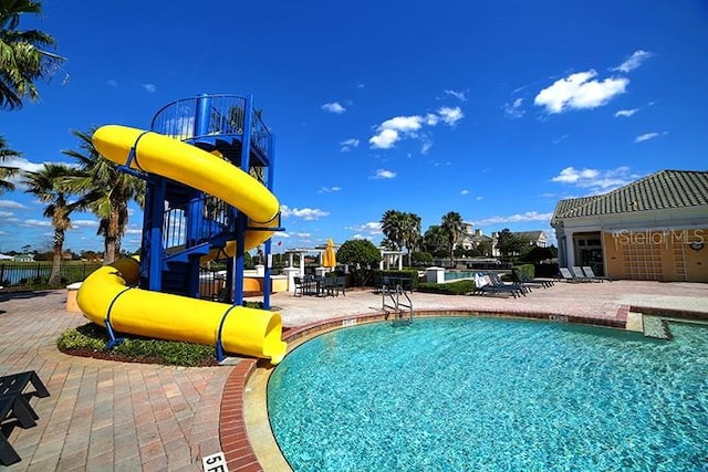 2333 Pinehurst Ct, Davenport, FL 33837 - community pool with a patio area