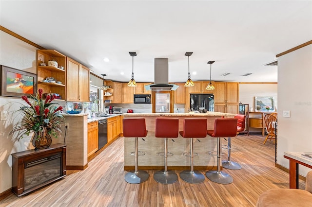 1096 Dyson Dr, Winter Springs, FL 32708 - kitchen featuring open shelves, black appliances, island range hood, light wood finished floors, and a kitchen bar