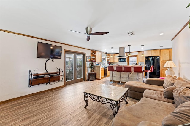 1096 Dyson Dr, Winter Springs, FL 32708 - living room with light wood-style floors, ornamental molding, baseboards, ceiling fan, and recessed lighting