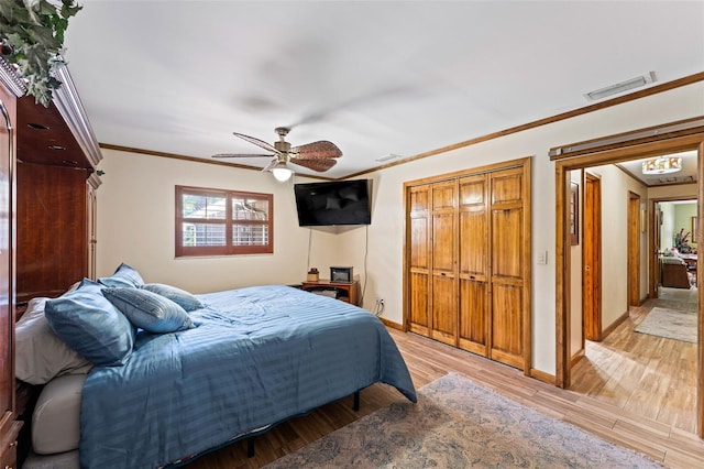 1096 Dyson Dr, Winter Springs, FL 32708 - bedroom featuring crown molding, baseboards, light wood-type flooring, and ceiling fan