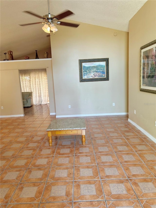 2779 Theresa Dr, Kissimmee, FL 34744 - spare room with a ceiling fan, baseboards, a textured ceiling, and high vaulted ceiling