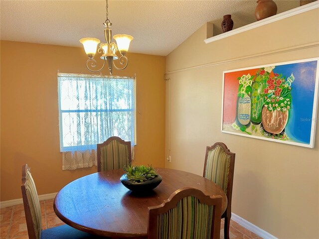 2779 Theresa Dr, Kissimmee, FL 34744 - dining space with a chandelier, a textured ceiling, and tile patterned flooring