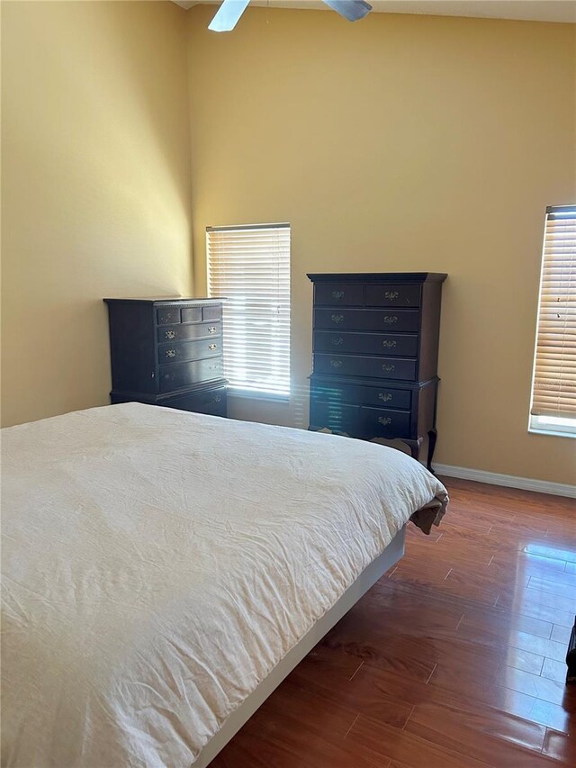 2779 Theresa Dr, Kissimmee, FL 34744 - bedroom with wood finished floors, baseboards, and a ceiling fan