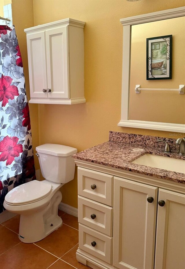 2779 Theresa Dr, Kissimmee, FL 34744 - bathroom with vanity, tile patterned flooring, toilet, and a shower with shower curtain