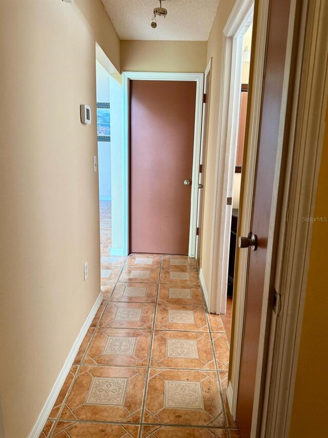2779 Theresa Dr, Kissimmee, FL 34744 - hall featuring a textured ceiling