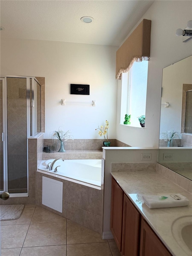 2514 Dharma Cir, Kissimmee, FL 34746 - full bathroom with a bath, vanity, tile patterned floors, and a stall shower