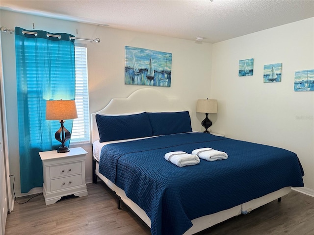 2514 Dharma Cir, Kissimmee, FL 34746 - bedroom with wood finished floors