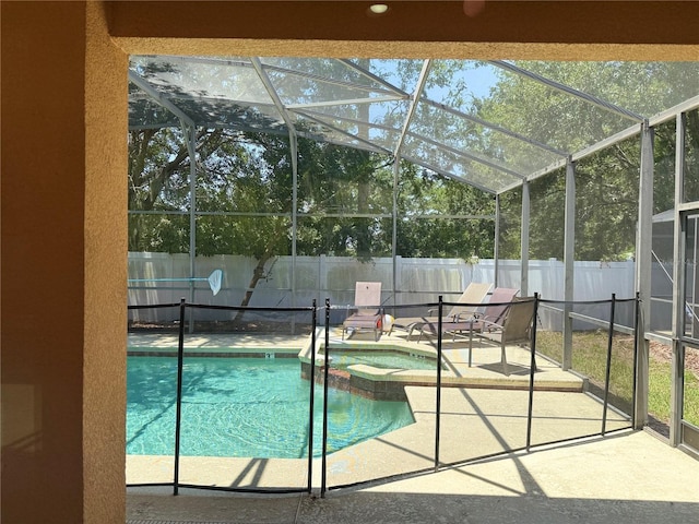 2514 Dharma Cir, Kissimmee, FL 34746 - view of pool featuring a fenced backyard, a patio, glass enclosure, and a pool with connected hot tub