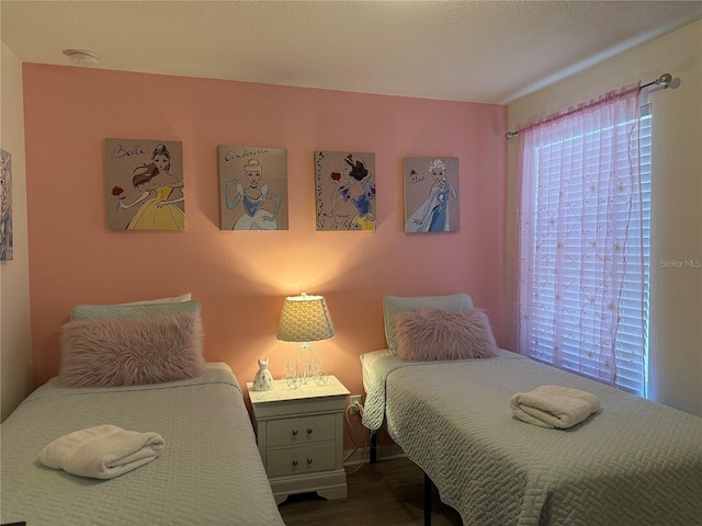 2514 Dharma Cir, Kissimmee, FL 34746 - bedroom featuring dark wood-style flooring