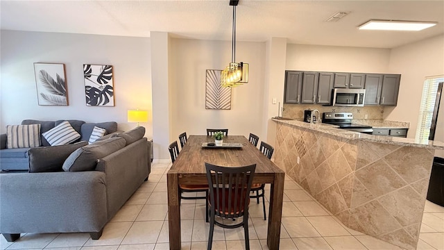 8517 Bay Lilly Loop, Kissimmee, FL 34747 - dining space featuring light tile patterned floors