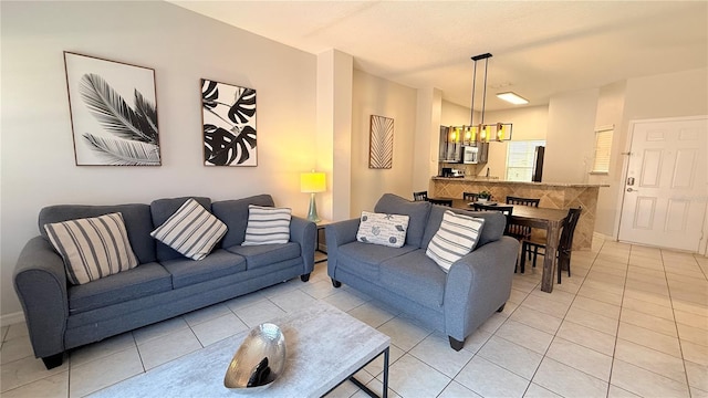 8517 Bay Lilly Loop, Kissimmee, FL 34747 - living room featuring light tile patterned flooring and baseboards