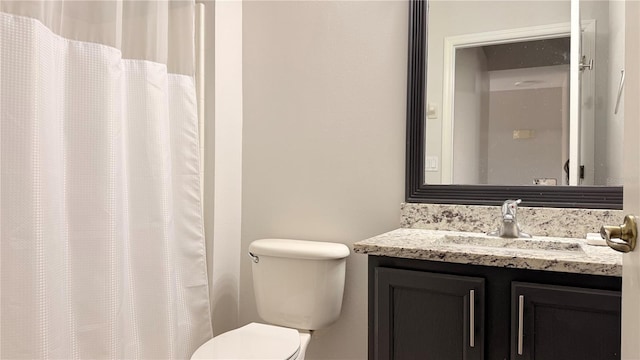 8517 Bay Lilly Loop, Kissimmee, FL 34747 - bathroom with toilet, vanity, and a shower with curtain